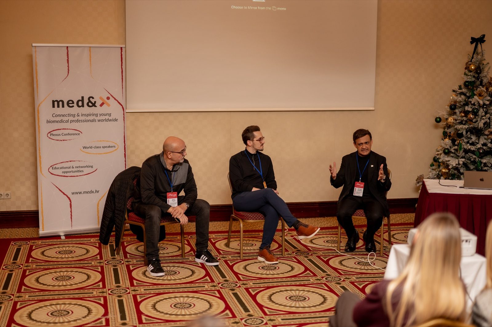 A panel discussion at a Plexus Conference session