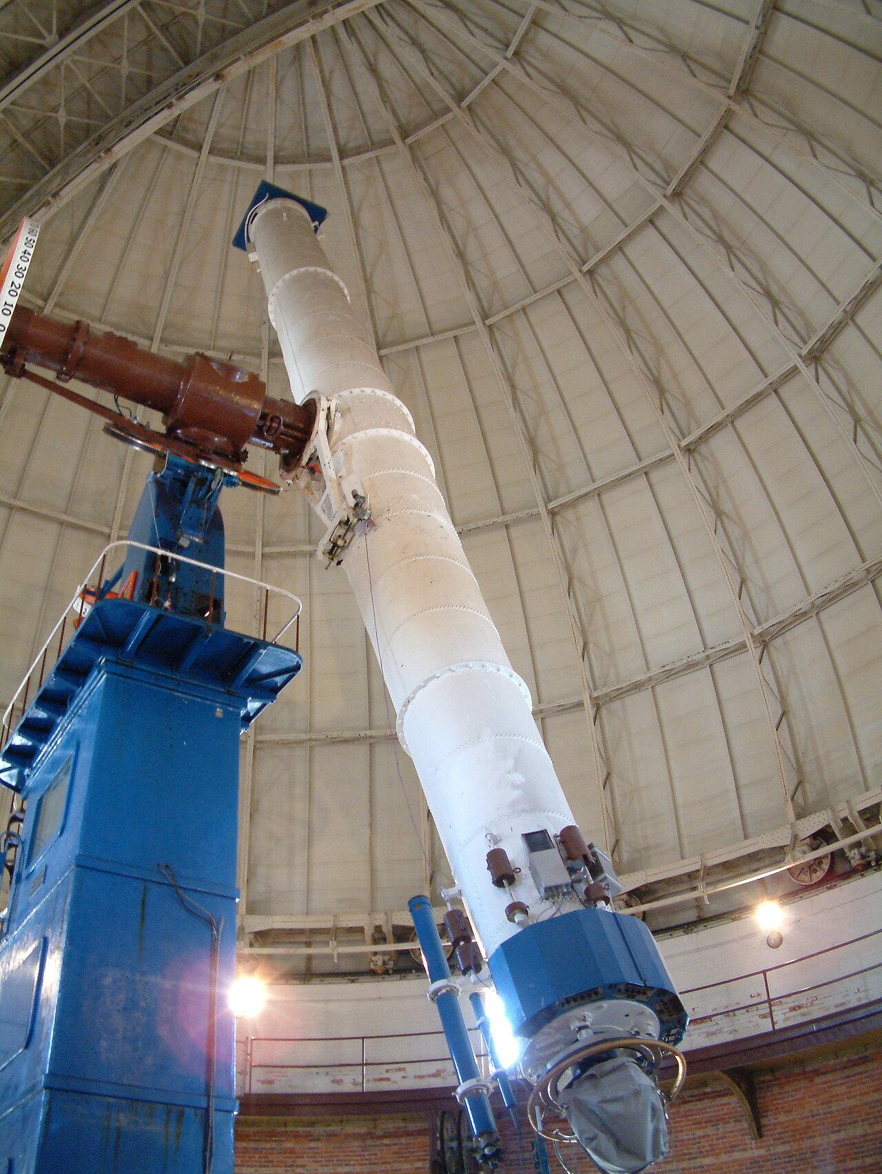 A large refracting telescope in its observatory dome